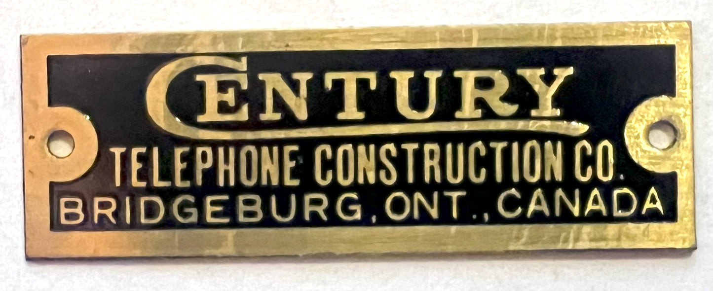 Brass Badge - Century Telephone Construction Co. - 1/2"x1.5"