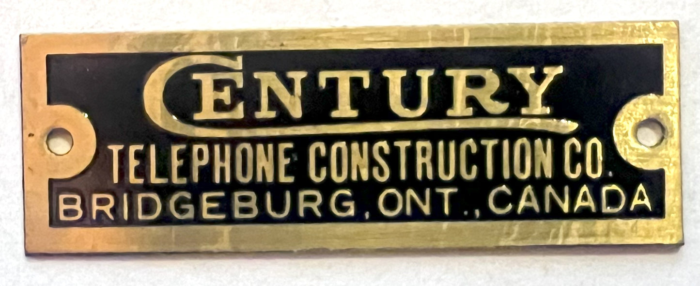 Brass Badge - Century Telephone Construction Co.  - 1/2"x1.5"