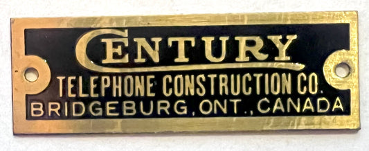 Brass Badge - Century Telephone Construction Co.  - 1/2"x1.5"