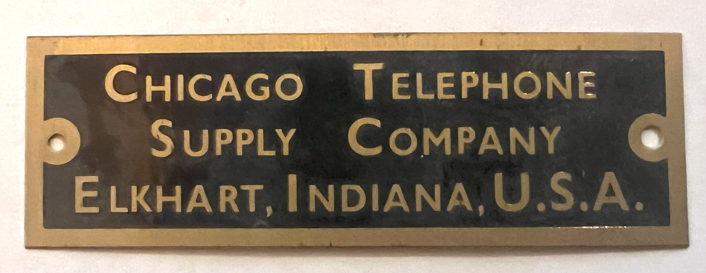 Brass Badge - Chicago Telephone Supply Co. - 1"x 3"