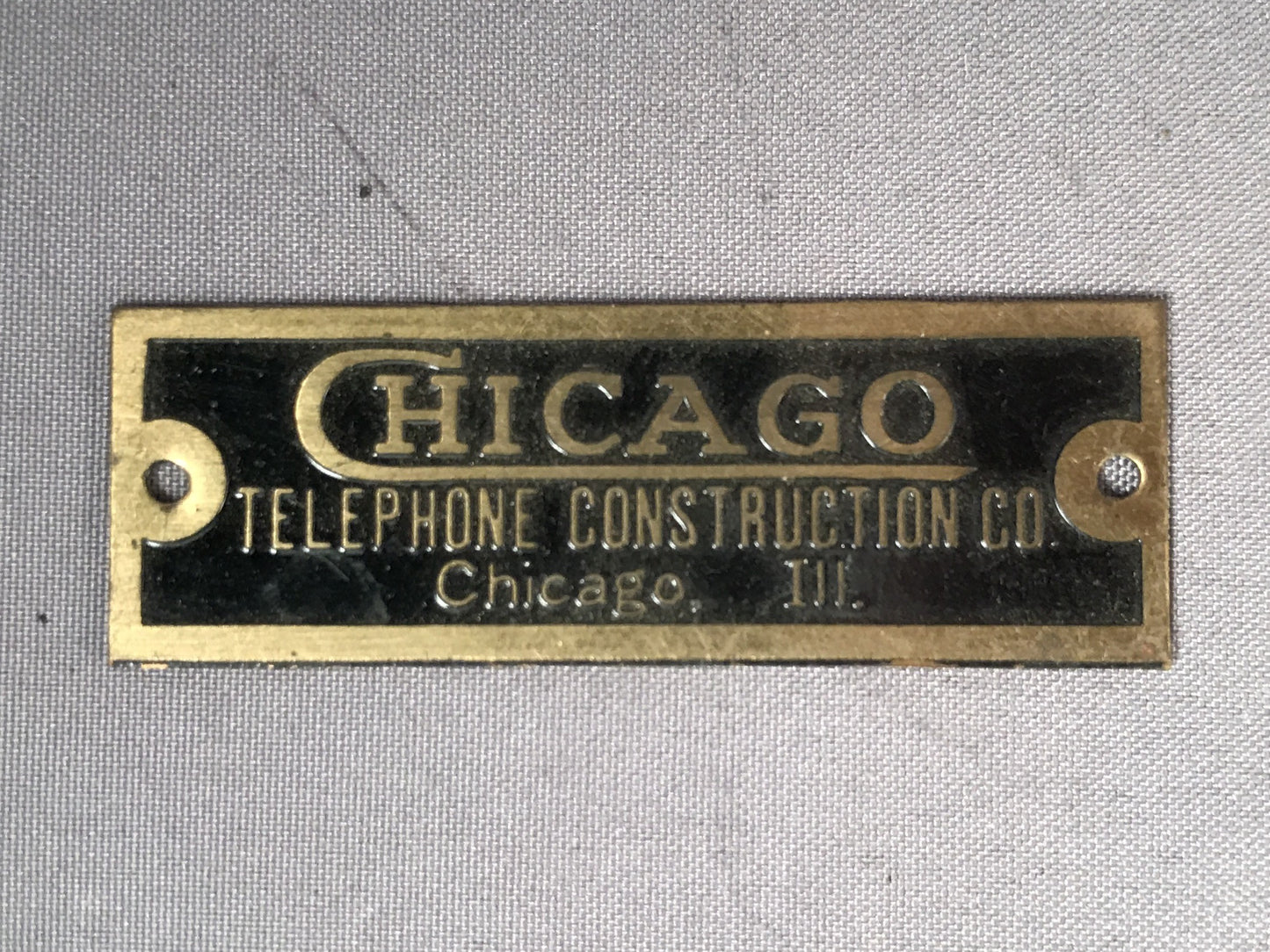 Brass Badge - Chicago Telephone Construction Co. - 1/2" x 1.5"
